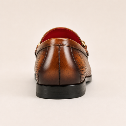 Brown leather loafers featuring breathable design